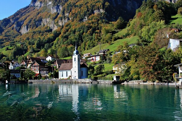Switzerland church in the mountains by the lake