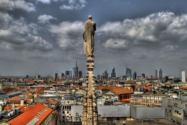 Guardian angel on the background of Milan