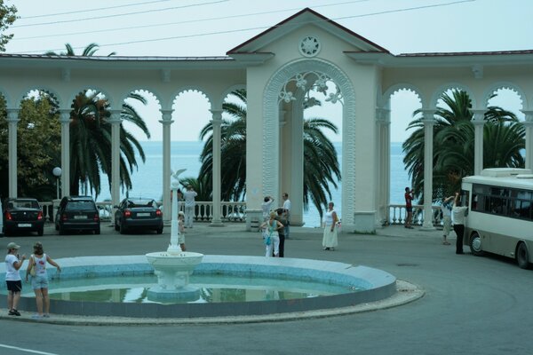 Tourists in Abkhazia near the arch