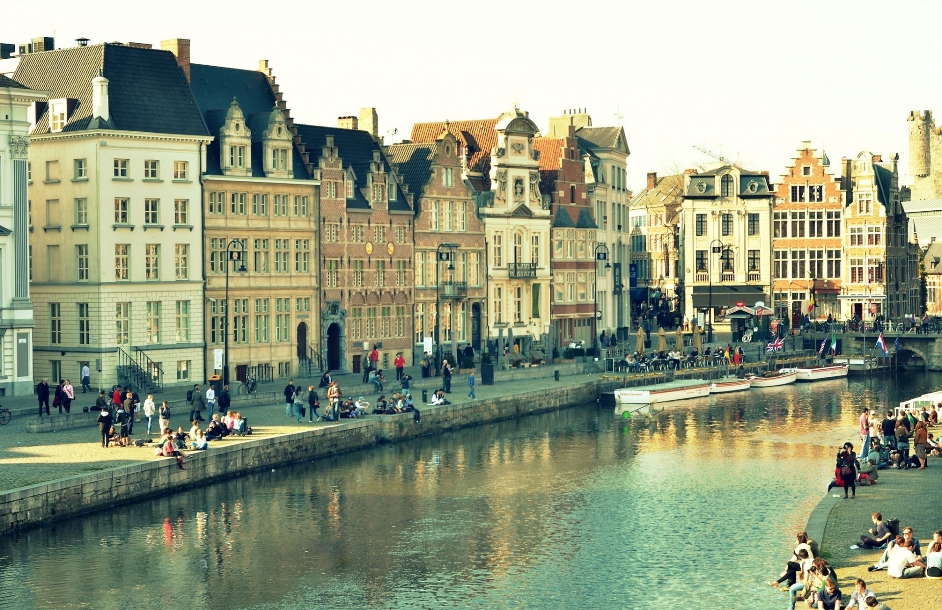 light window reflection bridge gent town water building belgium house channel people