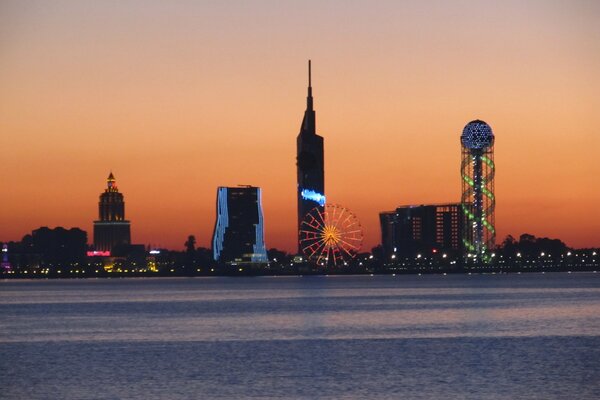 Cityscape by the sea at sunset