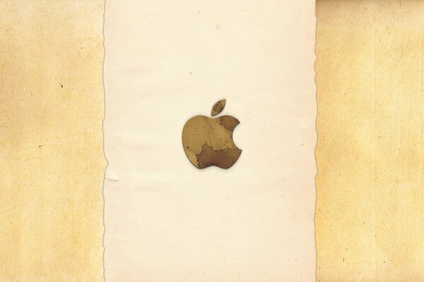 Логотип надкушенного яблока на бежевом фоне