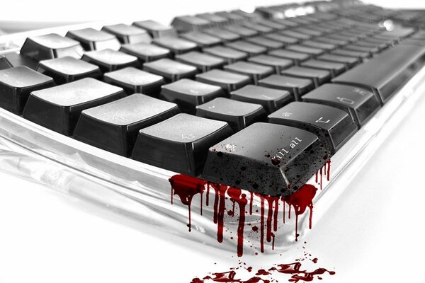 Teclado negro con gotas de sangre sobre fondo blanco