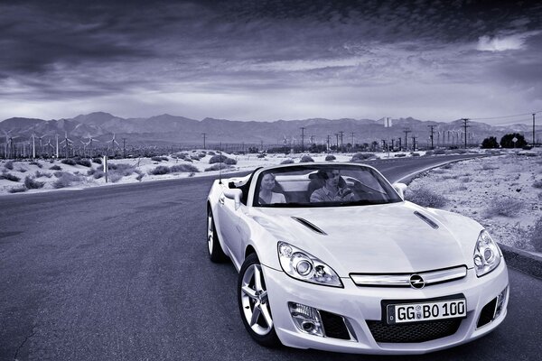 Opel convertible rides along windmills