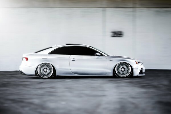 Grey Audi s5 in motion at speed