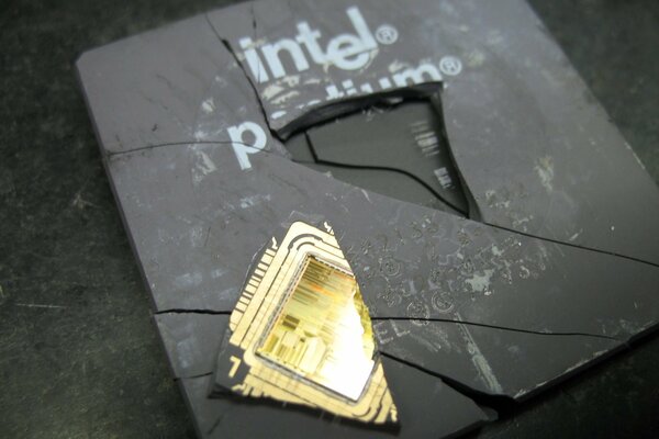 A broken intel processor in cracks with a shard