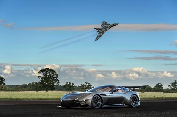 Supercar and airplane on the background of nature