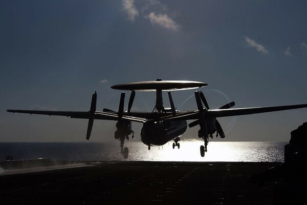 A military plane takes off on the runway