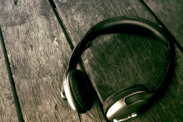 Headphones located on a wooden table