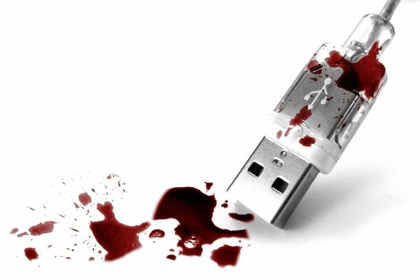 USB-Kabel im Blut auf weißem Hintergrund