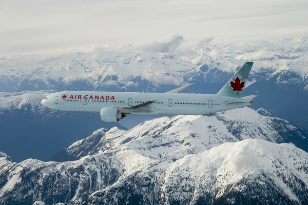 Air canada somalet flies over snow-capped mountains