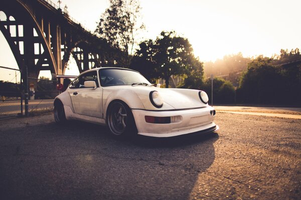 White Porsche at sunset
