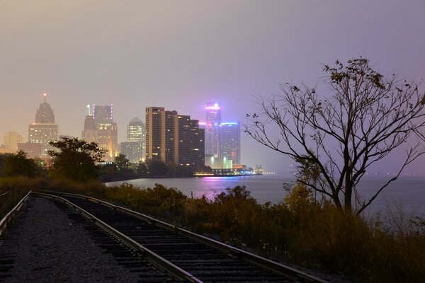 Foggy night city by the water