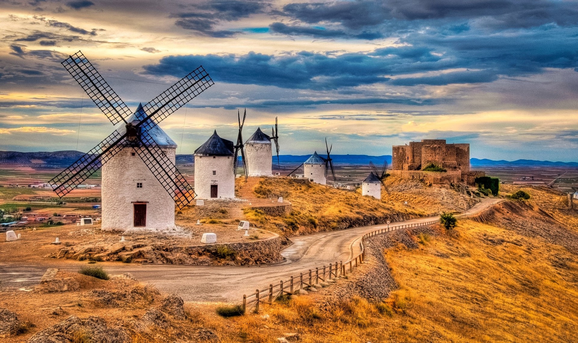 mill sky road clouds spain