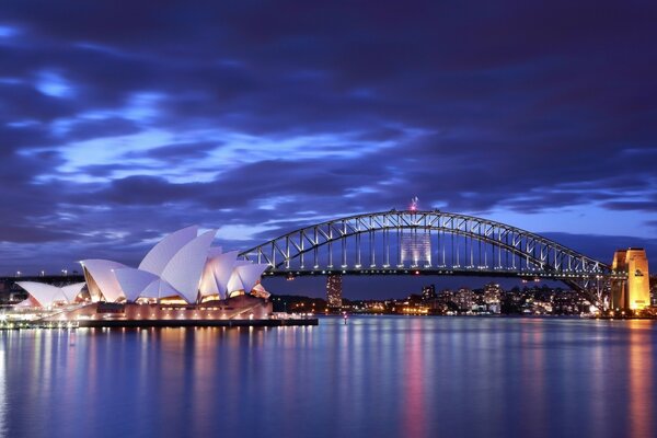 Night lighting over the sea and opera house