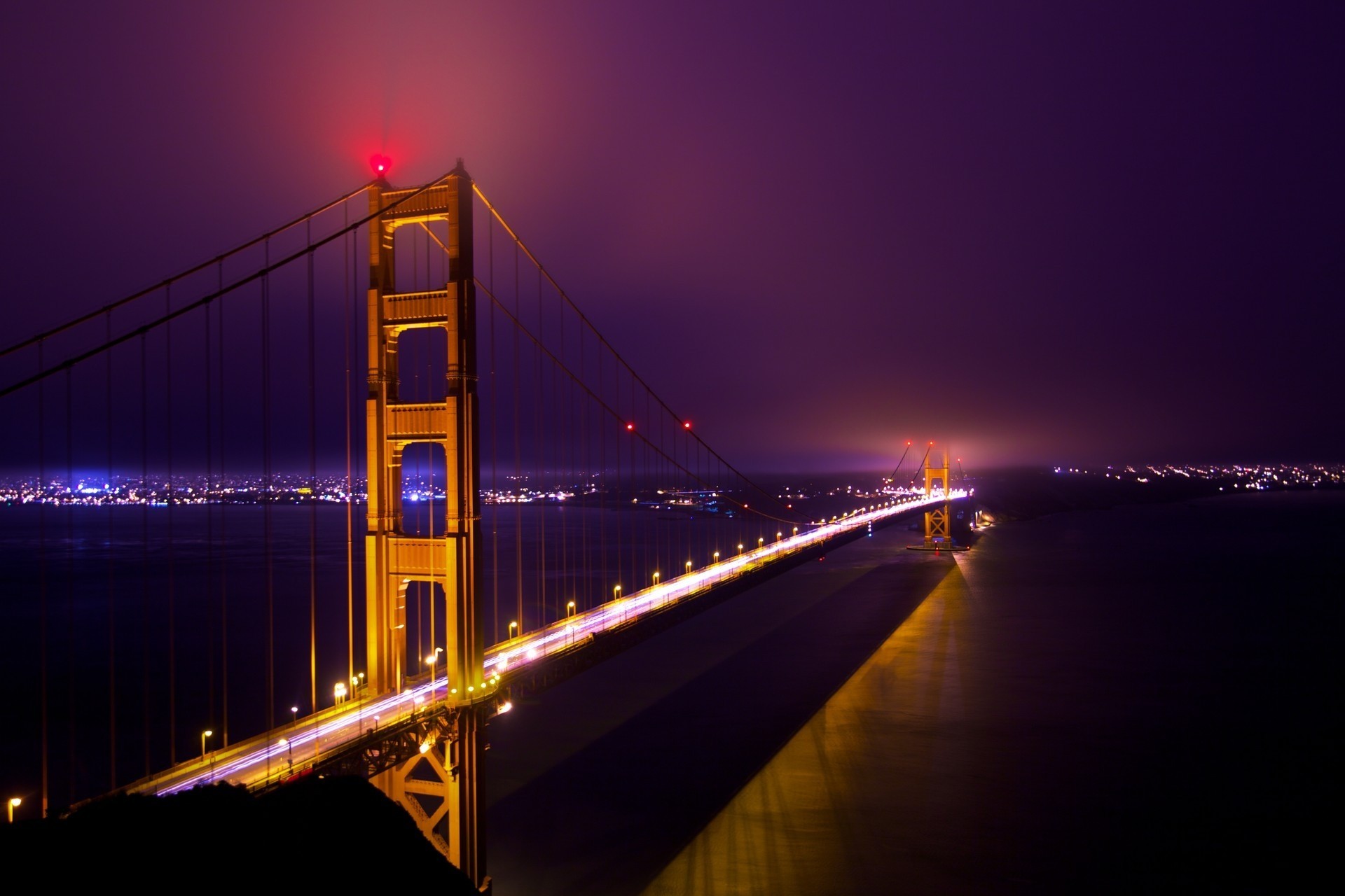 fog light gold night bridge gates long ocean