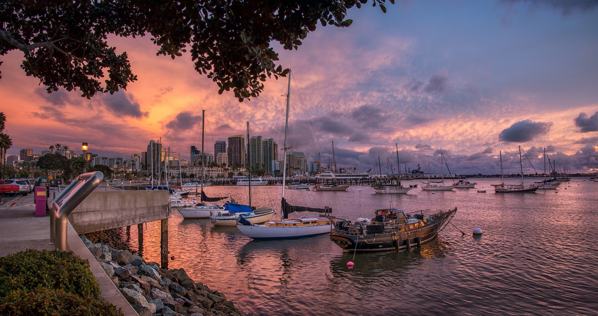 unset harbor town ships boat embankment house