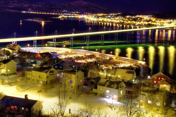 Norwegian bright bridge by the night river
