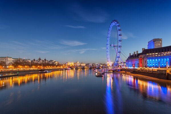 Ferris wheel over the River Thames at night