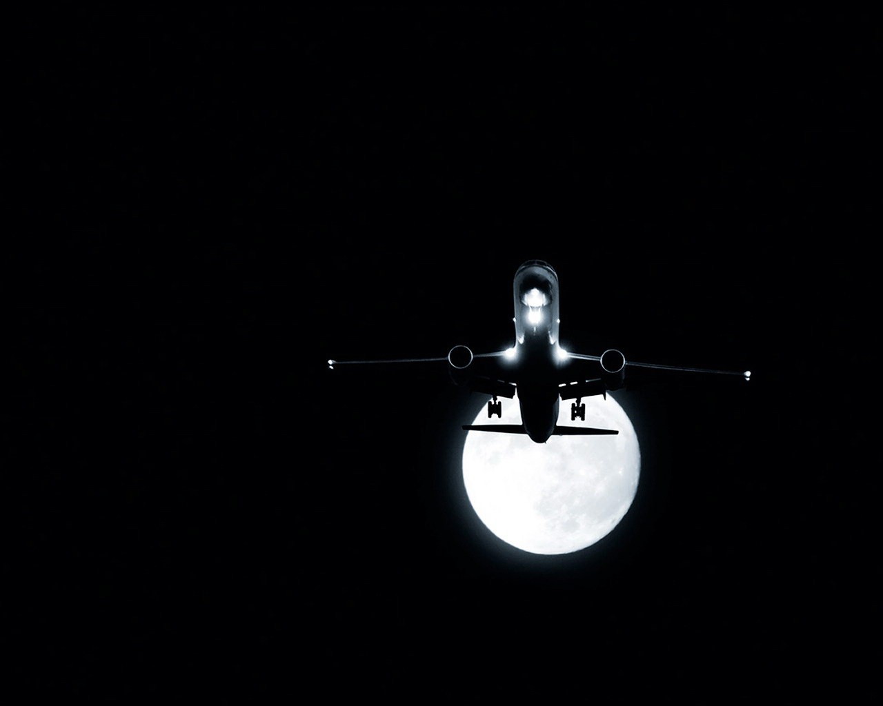 avión luna noche