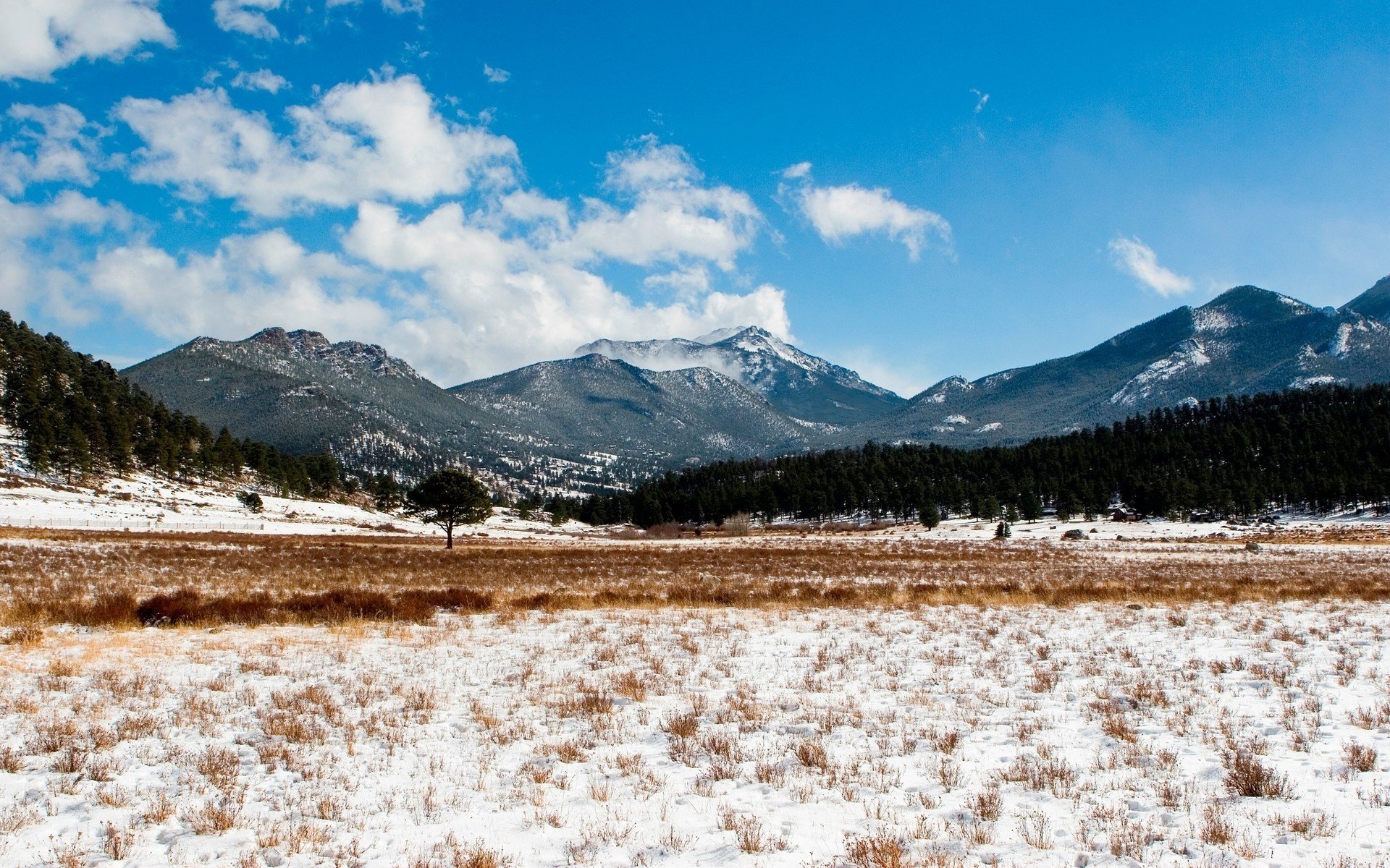 now-covered field mountains clouds hills snow winter sky clouds forest tree