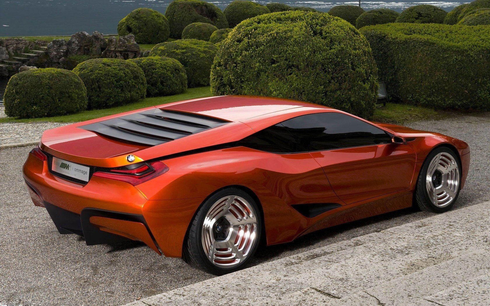 m1 hommage concept auto uomo bmw arancione cerchi cromati bmw cespugli verde profilo carriola fresca auto sportive veicoli auto veicoli a motore forma stile design ruote