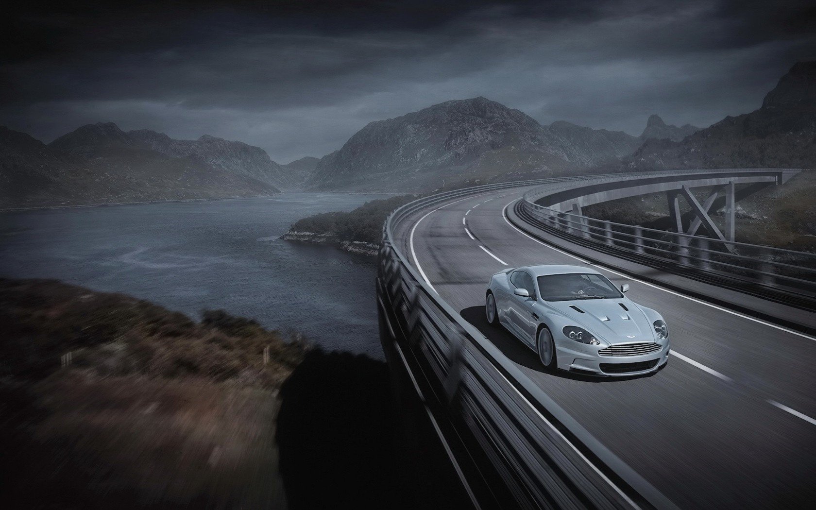 on the bridge in the turn aston martin aston martin gray river speed traffic marking turn silver car car passenger cars transport auto motor transport