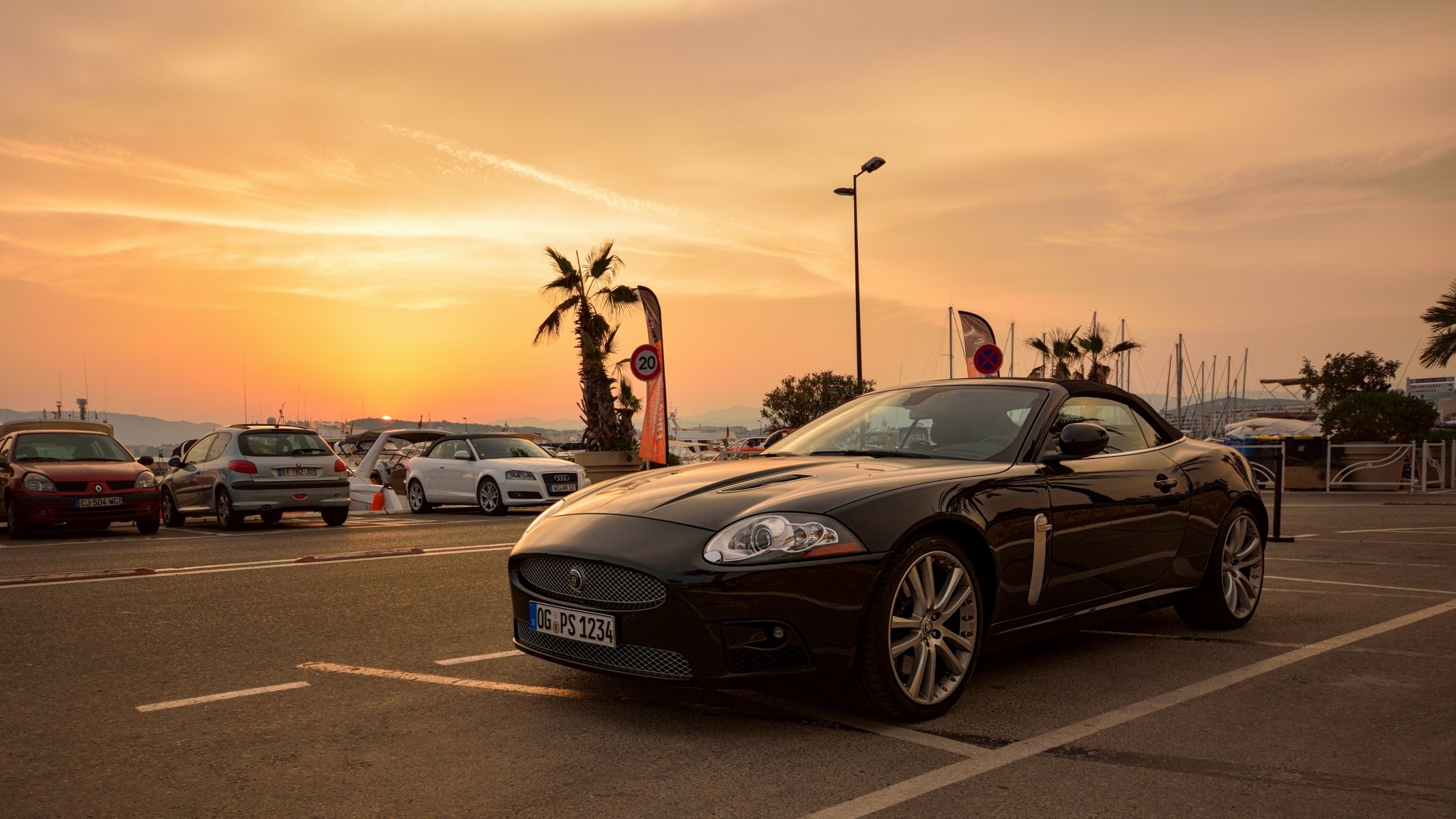 jaguar sports car parking sunset