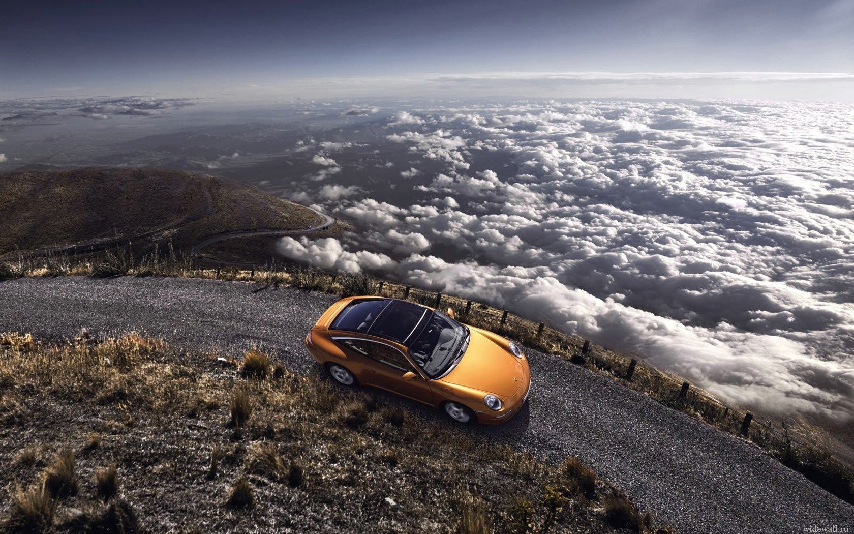 in the mountains porsche porshe above the clouds serpentine top view car car mountainous terrain orange car passenger cars transport motor transport