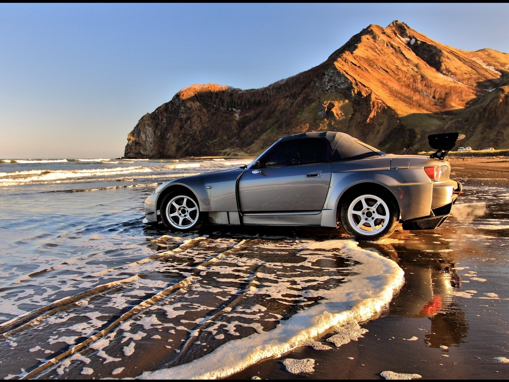 honda s2000 foam sea surf on the seashore rocks waves coast auto honda profile mountains car silver car transport motor transport sea sunset mountain silver wheels wheelbarrow