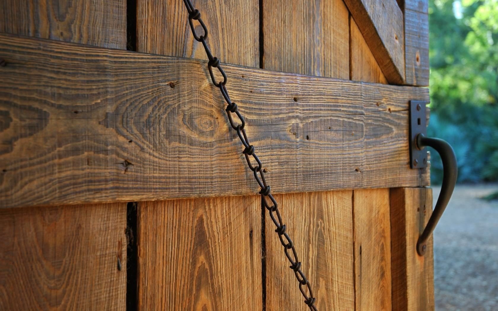 forged handle wooden door metal chain abstraction