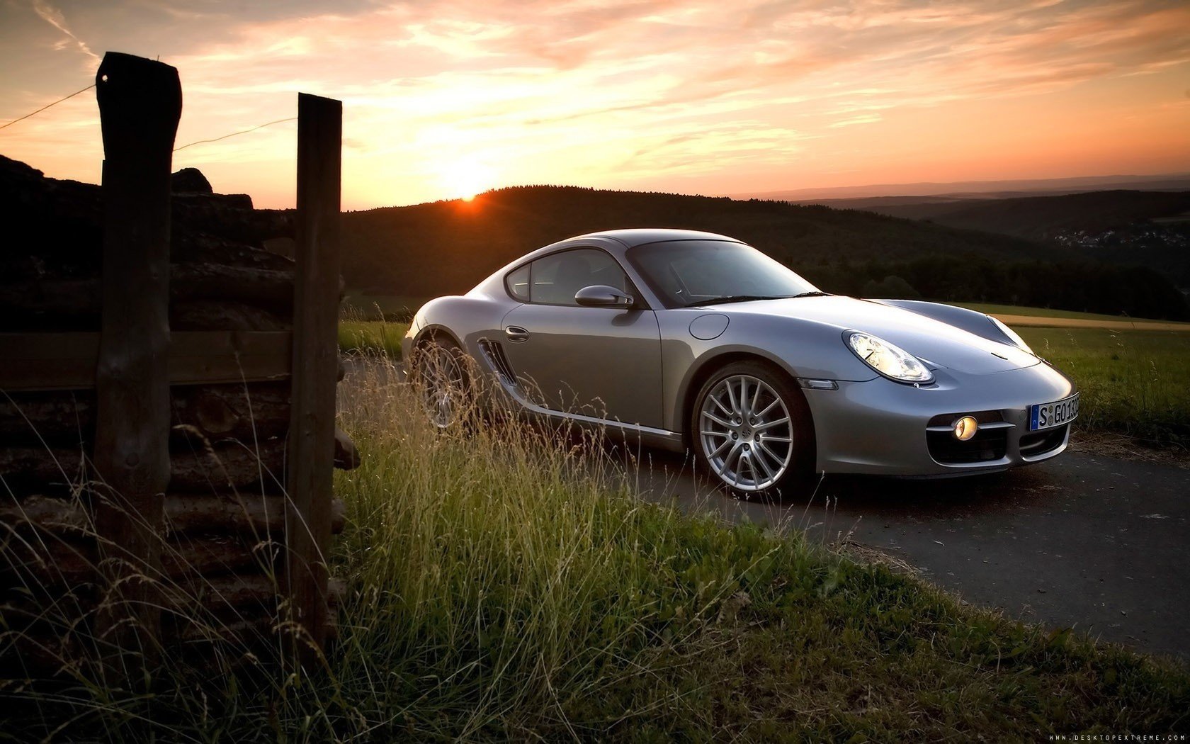 porsche cayman grey porsche outside the city sunset horizon auto silver car grass machine cars transport vehicles the evening headlight light field hills wood