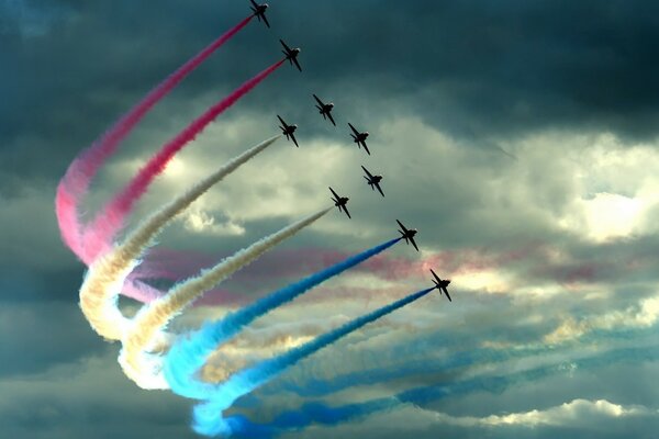Multicolored plumes from fighter planes