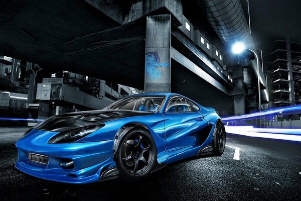Blue sports car at night