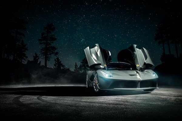 Ferrari on the background of the night starry sky