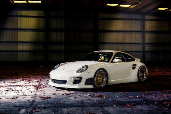 Popular white Porsche 911 in autumn