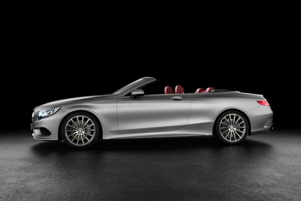 Silver Mercedes convertible with red interior