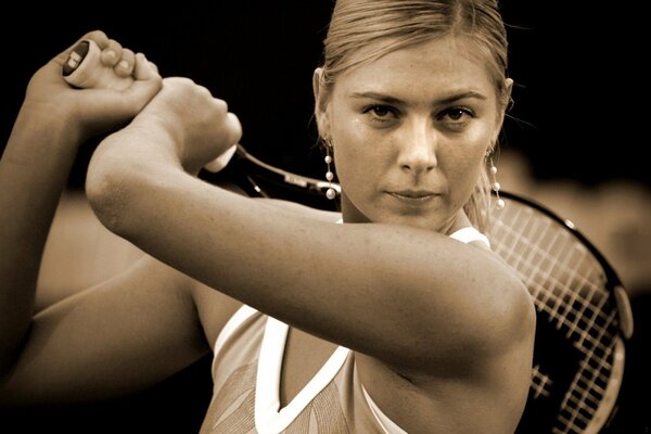 The tennis player prepared to beat off a blow with a racket