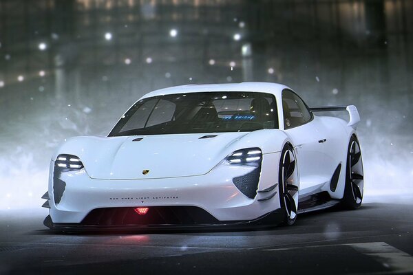 Porsche blanc sur fond de ville de nuit