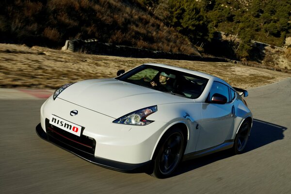 A white sports car on the road