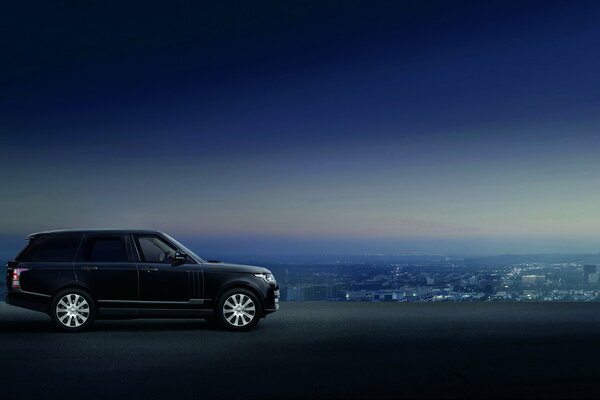 Car SUV range rover on guard of the city