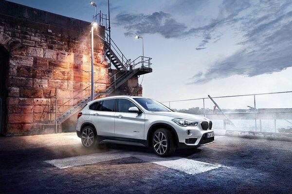 White BMW x1 car in fog