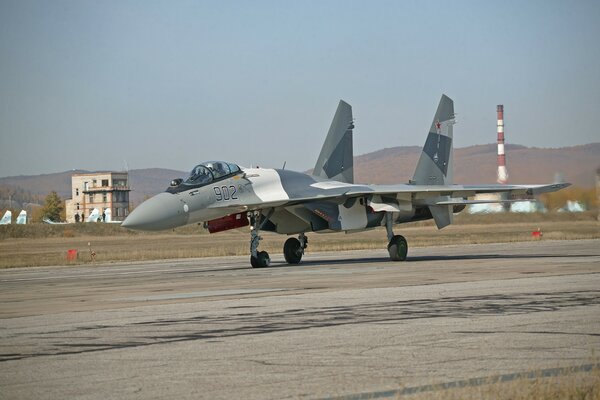 Russian military aircraft on the background of the sky and mountains