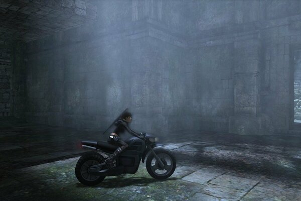 A girl on a black motorcycle in the fog