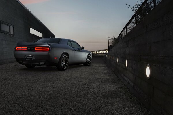 Dodge Challenger 2015 in gray with bright red headlights