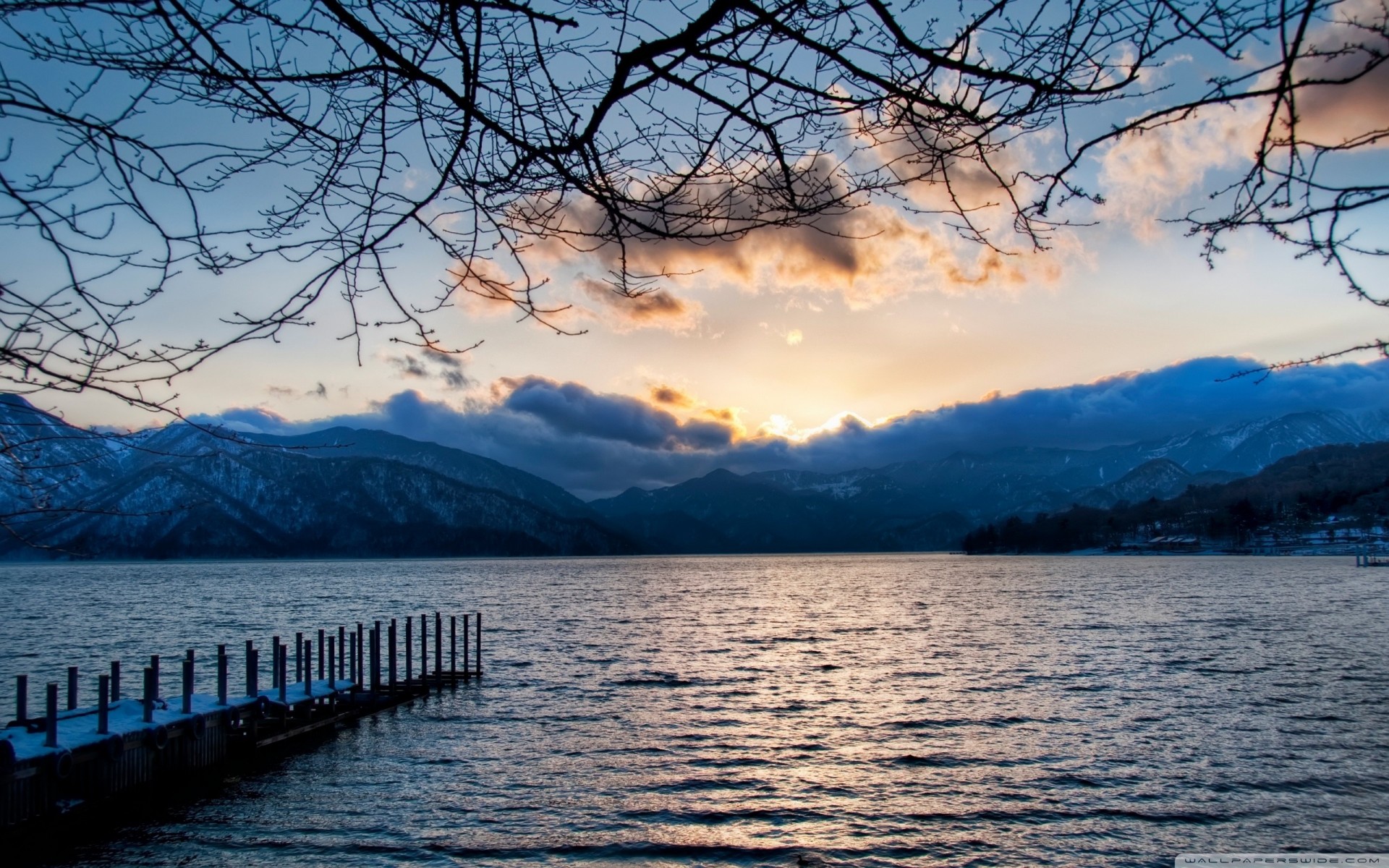 in the evening mountain lake clouds nikko branches japan