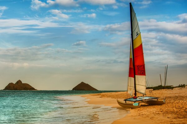 Boat in Hawaii on the beach in front of the ocean