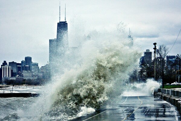 The road is covered by a wave during a storm