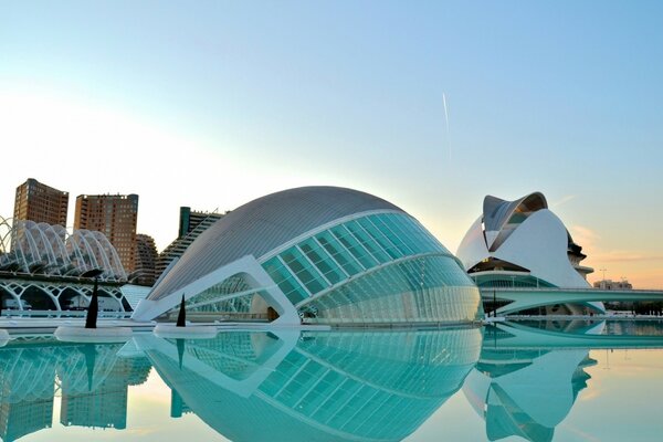 Beautiful and unusual architecture of the building reflected in the water