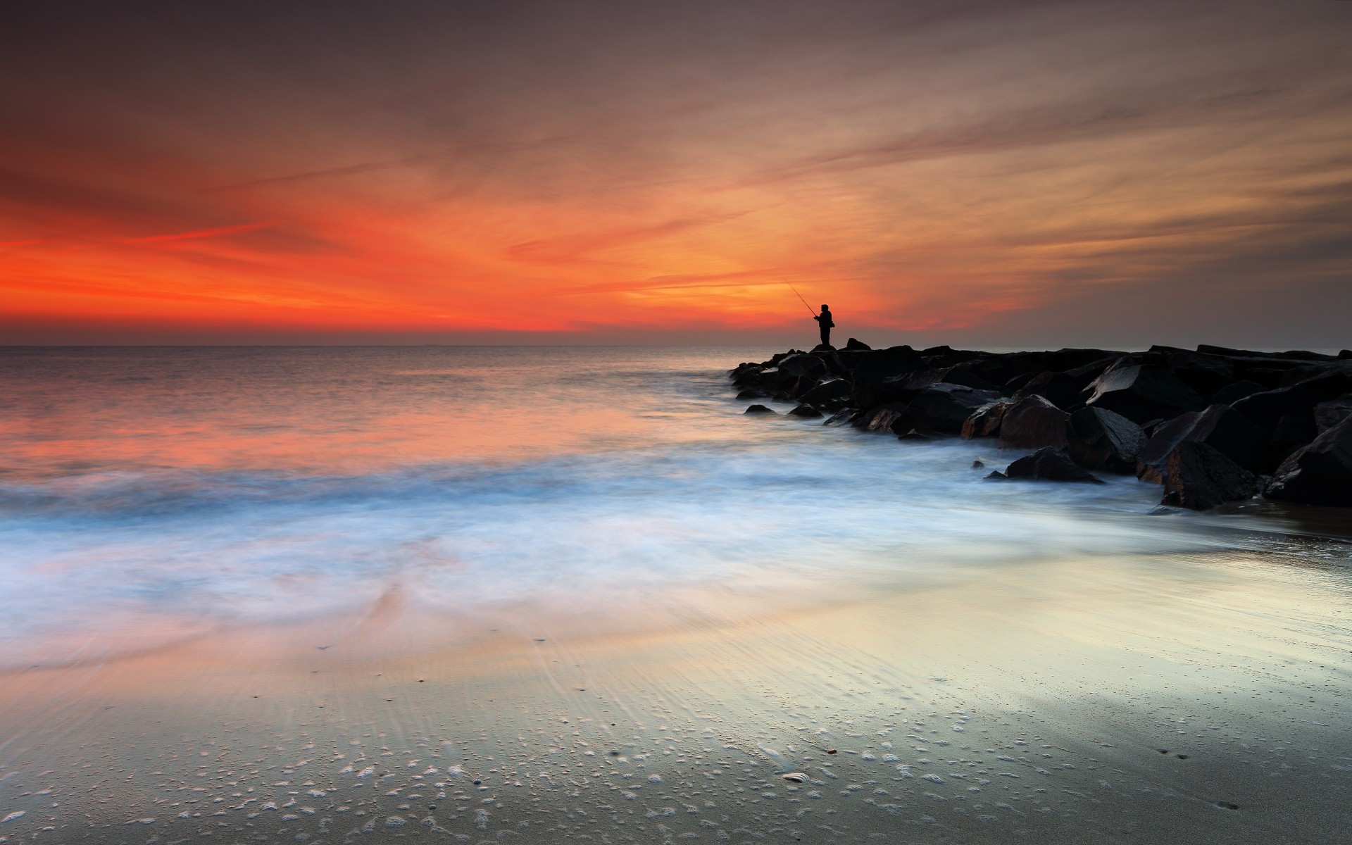 piedras mar costa pescador